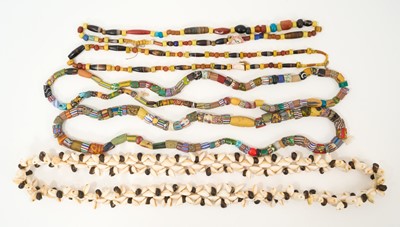 Lot 837 - Interesting group of four antique tribal bead necklaces, another with cowrie shells. Provenance: By descent from Admiral George Venour Fletcher, Governor of Fiji
