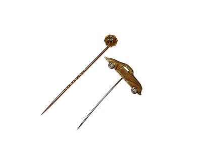 Lot 286 - Gold classic car stick pin with diamond set wheels, stamped 750, together with an Edwardian diamond stick pin (2)