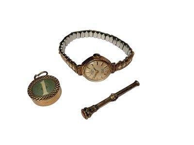 Lot 287 - Vintage 9ct gold cased ladies' Rotary wristwatch on expandable plated bracelet, 9ct gold mounted glazed banknote charm and a Victorian yellow metal propelling pencil (3)