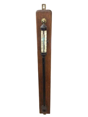 Lot 3077 - Antique Casella London marine barometer in black lacquered case with ivory face on a oak mount, 110cm long