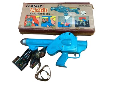 Lot 2002 - Louis Marx & Co Flashy Flickers Magic Picture Gun, Walkie Talkie, games and dolls house accessories (2 boxes)