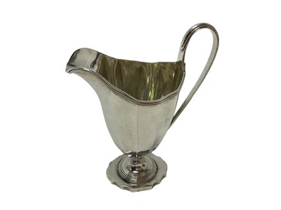 Lot 304 - Early George V silver helmet shaped cream jug