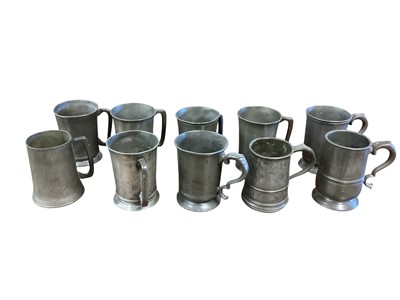 Lot 3108 - Collection of ten 19th century pewter Quart tavern tankards, each with pub / tavern names engraved to bases, (10).