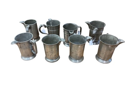 Lot 3110 - Collection of ten 19th century pewter Quart tavern tankards, each with pub / tavern names engraved to bases, (10).