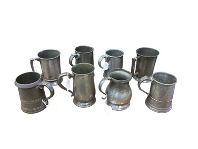 Lot 3116 - Collection of eight 19th century pewter Quart tavern tankards, each with pub / tavern names engraved to bases, (8).
