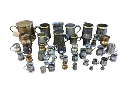 Lot 3125 - Group of pewter and brass tankards etc and a brass ice bucket in the form of a tankard (1 box)