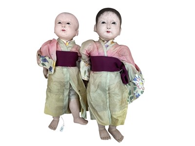 Lot 2003 - Four late 19th / early 20th century Japanese papier-mâché dolls, two females and two males all in traditional clothing. Tallest doll 29cm high