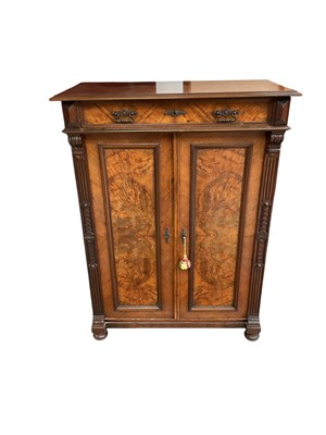 Lot 1497 - 19th century Continental walnut cupboard with single drawer and twin panel doors below, shelved baize-lined interior, on turned feet, 99.5cm wide, 50cm deep, 134cm high