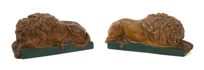 Lot 2 - Good pair of painted terracotta lions, typically modelled on green rectangular bases, 24cm wide