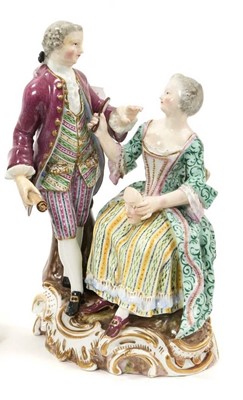 Lot 6 - 18th / 19th century Meissen porcelain group emblematic of 'Sight', modelled after Carl Punct, the seated lady holding a mirror and mask to the standing man, on a gilt rococo scroll base, crossed s...
