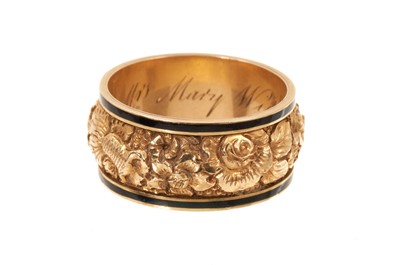 Lot 405 - George III gold and black enamel mourning ring, the wide band with repoussé floral decoration flanked by a black enamel border, the interior with engraved inscription 'Mrs Mary Wilson, Ob. 26 Ju...