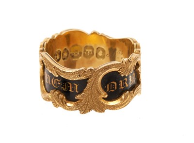 Lot 407 - William IV 18ct gold and black enamel mourning ring with a wide black enamel band with gothic gold script 'In Memory Of', applied gold rococo floral scrolls, the interior inscribed 'Mrs Mary Mil...
