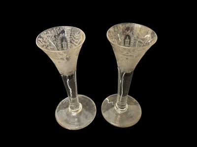 Lot 31 - Pair of 18th century plain stem wine glasses, etched with Chinoiserie scenes, 14.75cm high