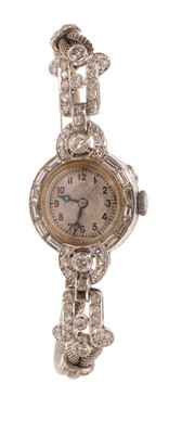 Lot 541 - Art Deco diamond cocktail watch with Swiss Movado 15 jewel movement in platinum case with baguette cut, brilliant cut and single cut diamonds to the bezel and articulated lugs, on a white gold d...