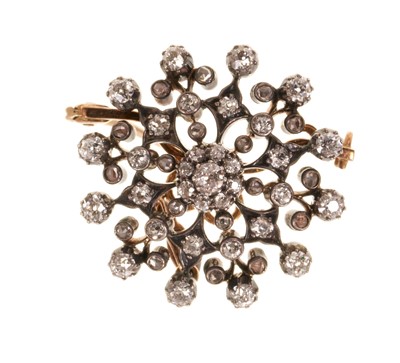 Lot 411 - Victorian diamond snowflake pendant / Roche with old cut and rose cut diamonds in silver setting on gold, with detachable pendant and brooch fitting, estimated total diamond weight approximately...