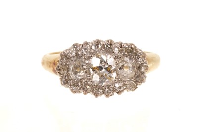 Lot 412 - Victorian diamond cluster ring with three oval old-cut diamonds surrounded by a border of nineteen smaller old cut diamonds in claw setting with pierced gallery on tapered gold shank, estimated...