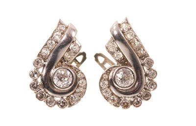 Lot 413 - Pair of Art Deco diamond earrings, the stylised scroll with graduated old cut diamonds, continental hallmarks, probably French, estimated total diamond weight approximately 1.5cts