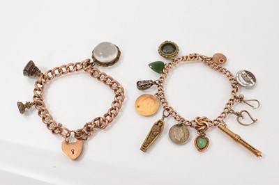 Lot 470 - Two antique charm bracelets with a collection of charms to include a half sovereign, two seals, and other charms