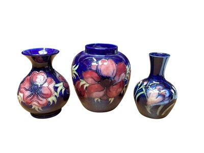 Lot 5018 - Three Moorcroft anemone pattern vases