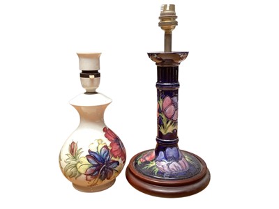 Lot 2204 - Moorcroft pottery Hibiscus pattern lamp, together with another Moorcroft lamp (2)