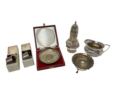 Lot 284 - Group of silver including castor, milk jug, cased dish, sugar bowl, pair of cased napkin rings