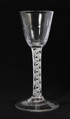 Lot 9 - 18th century wine glass, the fluted round funnel bowl over a double series opaque twist stem