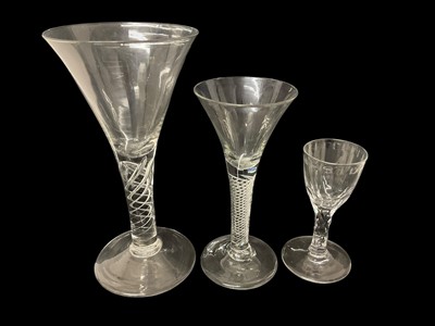 Lot 58 - Three 18th century glasses, including a large air twist glass, another air twist, and a facet cut glass, 12.5cm to 22.25m high
