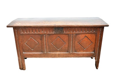 Lot 1427 - Good 17th century oak coffer, with chip carved ends and internal candle box, the triple panel front with arcaded frieze, raised on stiles