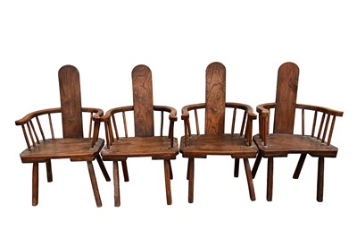 Lot 1433 - Unusual set of four primitive Welsh oak stick back chairs, each with solid seat on splayed supports