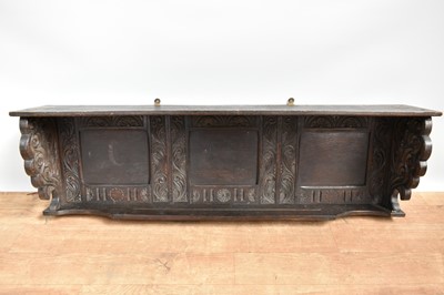 Lot 1440 - 19th century carved oak hanging wall shelf, with panelled back and ornate carved ends, 117cm wide x 21cm deep x 35cm high