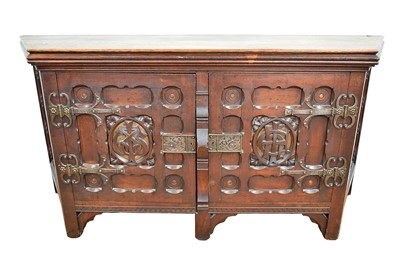 Lot 1455 - Impressive 19th century gothic revival sideboard, of trapezoidal from, boldly carved with entwined initials to the twin doors, with glazed sides and cut steel fittings, 185cm wide x 55cm deep x...