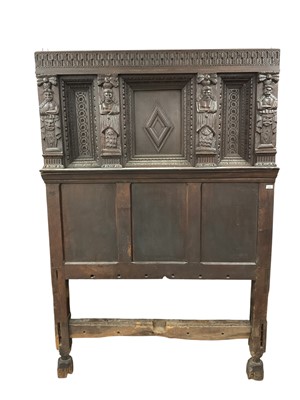 Lot 1458 - 17th century style carved oak four poster bed, with elaborate carved headboard and panelled canopy, approximately 140cm wide