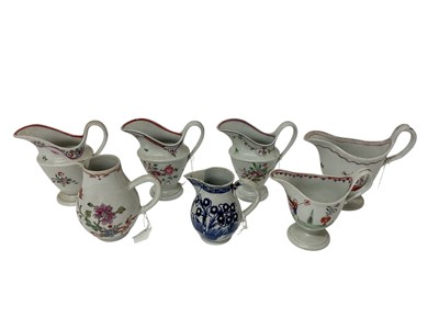 Lot 102 - Seven New Hall and other cream jugs, late 18th century, including one blue and white Liverpool jug, the others polychrome decoerated with flowers and Chinese figures