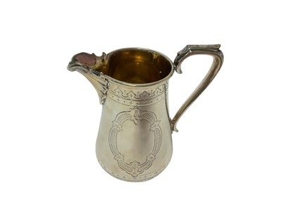 Lot 295 - Victorian silver cream jug of baluster form, with engraved decoration