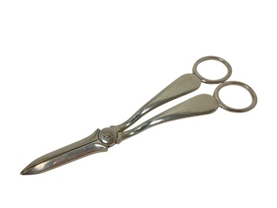 Lot 297 - Pair of Victorian silver grape scissors of plain form, with flower head engraved hinge