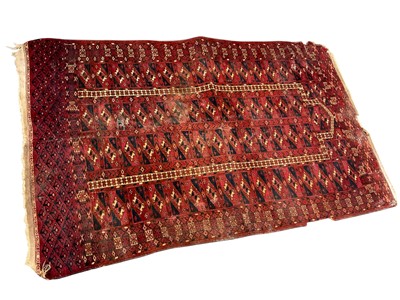 Lot 1561 - Antique Tekke prayer rug, with central mirhab and four rows of quartered medallions, 147 x 56cm, together with a small Persian rug with central hexagonal medallion, 147 x 108cm