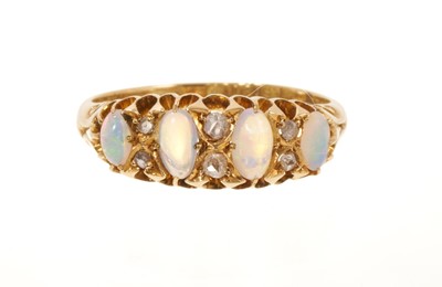 Lot 514 - Victorian opal and diamond ring with four oval cabochon opals interspaced by six rose cut diamonds in gold setting with carved shoulders on tapered 18ct gold shank, Birmingham 1901, ring size N½...