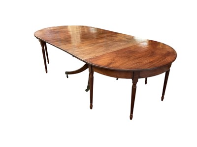 Lot 1514 - George III mahogany dining table in three sections