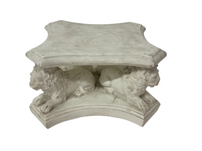 Lot 106 - Biscuit porcelain plinth / vase stand, 18th/19th century, the shaped top resting on the backs of four recumbent lions, 16cm