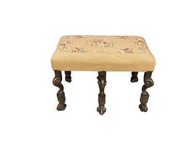 Lot 1544 - William and Mary style walnut stool, with embroidered top on Braganza supports, approximately 62cm long