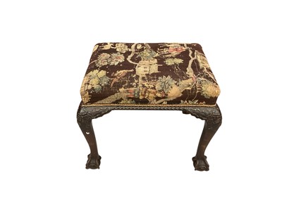 Lot 1545 - George II style walnut stool, with tapestry seat on ribbon carved cabriole legs and claw and ball feet, 58cm wide
