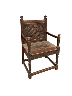 Lot 1546 - Elizabethan style carved oak wainscott chair, with arcade carved panel back and plank seat on fluted baluster supports