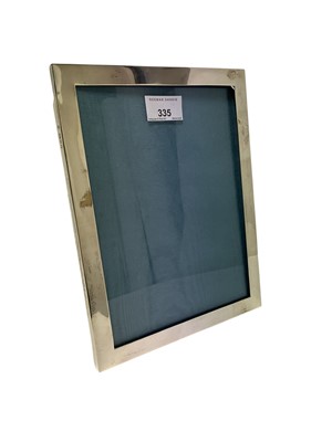Lot 335 - Early 20th century silver photograph frame (Chester 1928) William Base & Sons, 25.3cm high