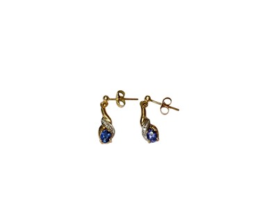 Lot 76 - Pair of tanzanite and diamond pendant drop earrings in yellow metal setting