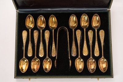 Lot 458 - Set of twelve fine Victorian silver gilt teaspoons, the terminals each depicting two kingfishers hunting, together with matching sugar tongs, (London 1884)