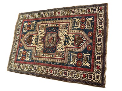 Lot 1567 - Kazak rug, with stepped cream medallion in flowerhead border, 154 x 114cm