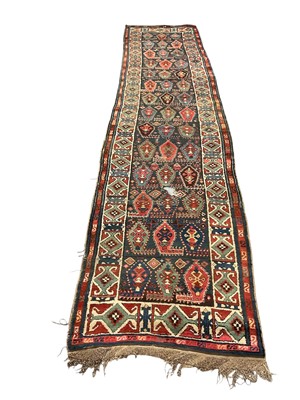 Lot 1568 - Kazak runner, with repeat vase motif on midnight blue ground, approximately 410 x 90cm