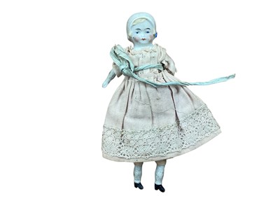 Lot 1918 - Two early dolls, one with bisque head and shoulders,kid body, moulded hair, fixed eyes