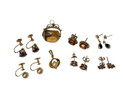 Lot 101 - Six pairs of 9ct gold gem set earrings, 9ct gold cultured pearl pendant and 9ct gold mounted quartz rotating seal
