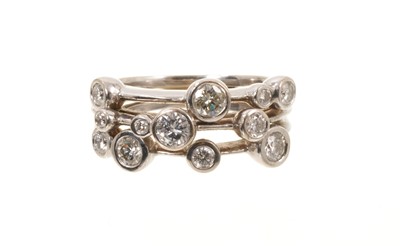 Lot 667 - 18ct white gold diamond 'rain dance' ring